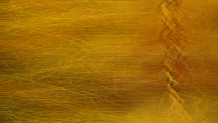 Abstract golden texture with intricate, vertical lines.