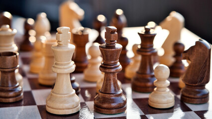 Chess pieces arranged in strategic and symbolic positions. The image can be interpreted through...