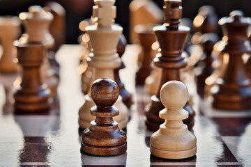 Chess pieces arranged in strategic and symbolic positions. The image can be interpreted through...