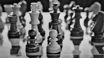 Chess pieces arranged in strategic and symbolic positions. The image can be interpreted through...