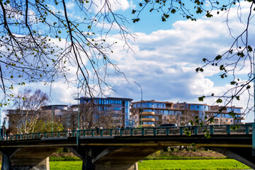 a bridge in the city against a background of small buildings