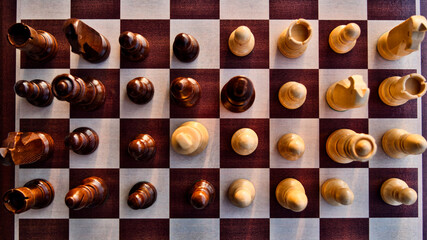 Chess pieces arranged in strategic and symbolic positions. The image can be interpreted through...