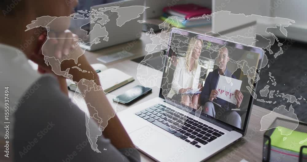 Poster viewer watching business hosts speaking while world map overlay illustrating data network on laptop