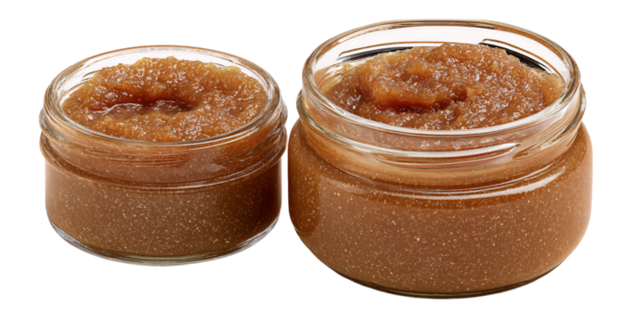Two jars of homemade brown sugar scrub for skincare and exfoliation Natural beauty treatment in glass containers for body care and wellness