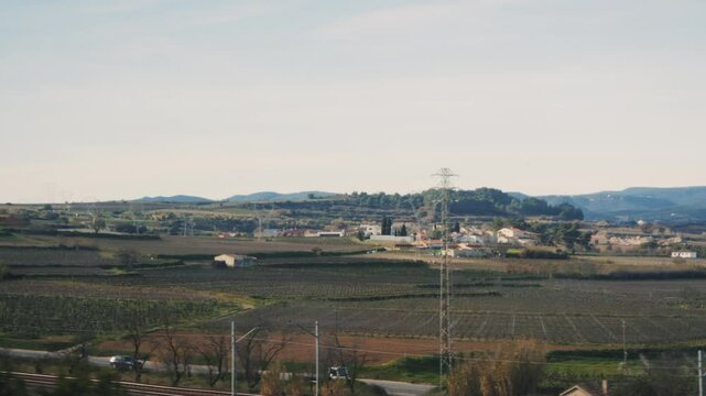 View from the window of a high-speed train. Landscape view of the city and fields, medows. High quality 4k footage