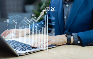 Business growth trends and 2026 projections. Businessman analyzing financial data for long term investment planning and enhancing global corporate competitiveness.