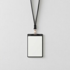 A blank black ID card holder hangs from a black lanyard against a light grey background