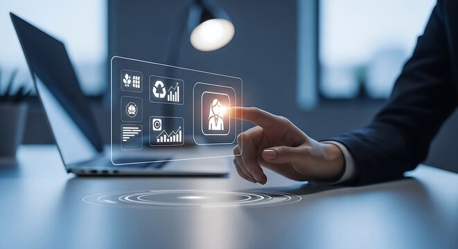 Modern business person interacts with a futuristic holographic interface, using laptop for advanced data management and analytics.
