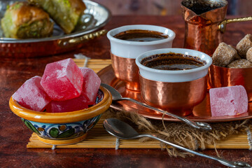Traditional black Bosnian coffee in beautiful copper cezve and cups