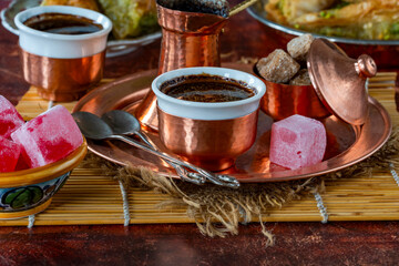 Traditional black Bosnian coffee in beautiful copper cezve and cups
