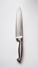 Sharp chef knife on a clean surface.