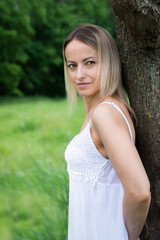 Young beautiful girl in nature in a rustic style.