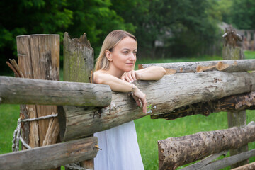 Young beautiful girl in nature in a rustic style.