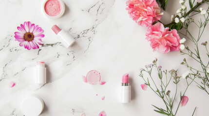 lipstick and flowers on white marble top
