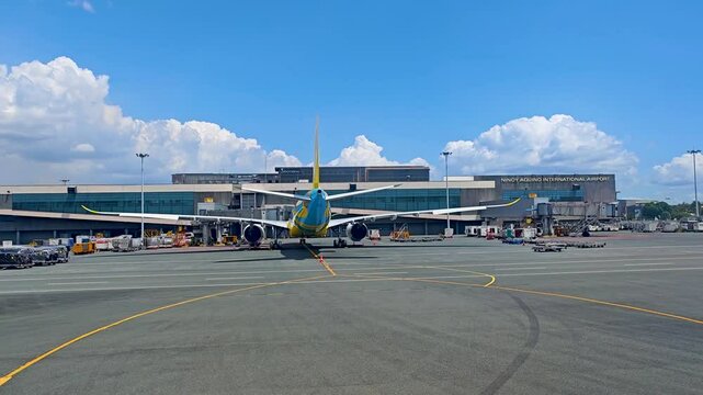 Manila, Philippines. Ninoy Aquino international airport. 4K video footage of airplane taxiing on the runway