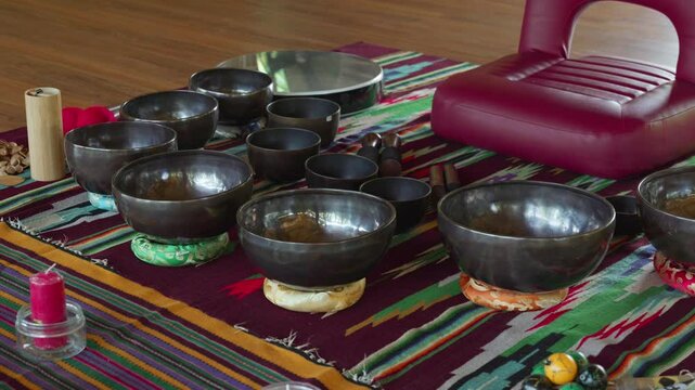 Tebet singing bowls stand on the floor before the start of the bowls ceremony