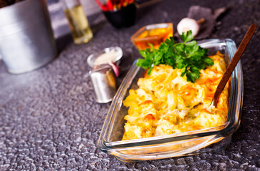 Fried cauliflower with eggs in baking dish. Space for text.