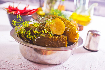 picled cucumber in metal bowl