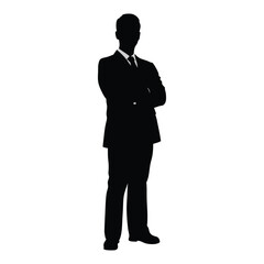 Silhouette of a confident businessman standing with arms crossed