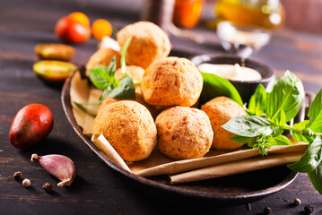 Overhead image of arabic snack falafel in the form of chickpea balls with spices.