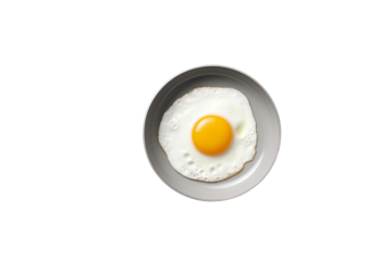 A single fried egg with a bright yellow yolk sits in a gray pan against a transparent background. background removed