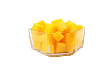 A glass bowl filled with diced mango pieces, a vibrant and refreshing summer treat. background removed
