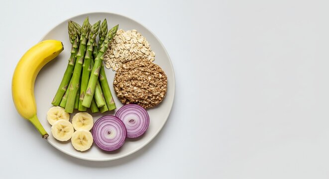 Prebiotic fiber sources on clean plate with banana and grains