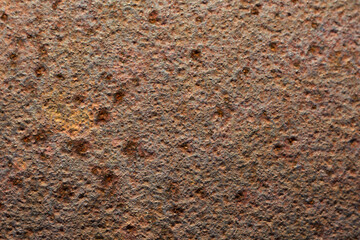 赤錆の背景用テクスチャー。経年劣化で錆びたガードレールの支柱