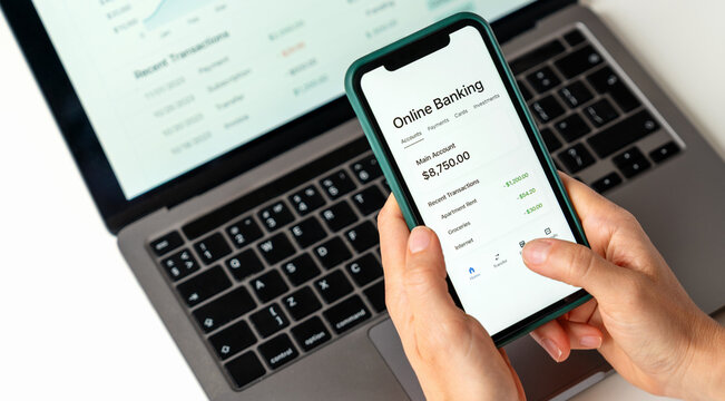 Closeup person using online banking mobile app.