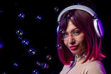 Futuristic woman with headphones and AR glasses surrounded by bubbles