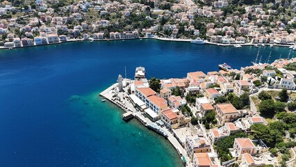 Fototapeta premium Aerial Photo of Symi Island, Greece – Colorful Harbor and Hillside Homes