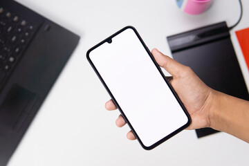 Cell phone white screen mockup, hand holding mobile phone with blank screen. mockup for social media marketing