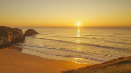 Golden hour at the beach with cliffs and waves reflecting the sun setting over the ocean horizon
