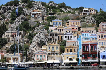 Sunlit Harbor of Symi Island, Greece &ndash; Coastal Charm in the Aegean Sea