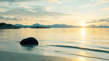 Serene Sunset Beach Scene with Mountains and Single Rock