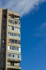 Soviet panel house and blue sky