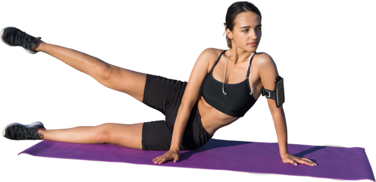 Young attractive woman doing exercise working out outdoors.