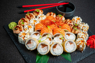 A stunning sushi platter features vibrant rolls and fresh sashimi, ideal for sharing