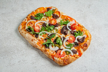 Freshly baked rectangular pizza features vibrant toppings, inviting all to indulge in its flavors