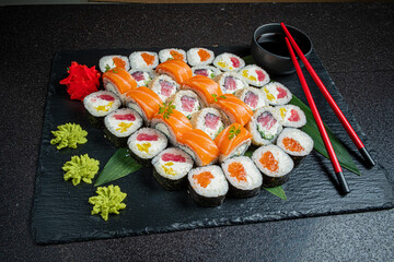 A vibrant sushi platter featuring fresh tuna and salmon with beautiful arrangements
