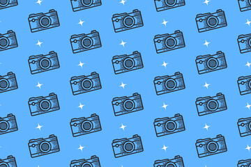 retro camera with light doodle pattern on blue background for packaging and merchandise. vintage photography engraving seamless pattern background. hand drawn photo gear motif wallpaper design