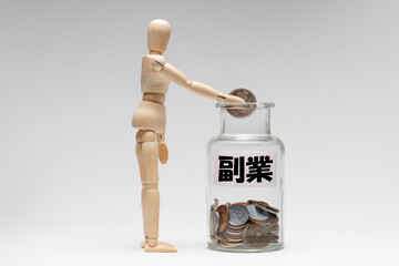 副業で貯金するデッサン人形