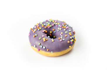 Colorful purple donut topped with sprinkles on a white background, capturing a sweet treat perfect...