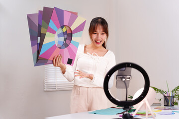 Online Personal Color Analysis Coaching by Asian Young Woman Influencer Explaining Palette for...