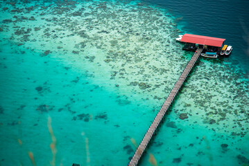 Turquoise ocean sea water white wave splashing deep blue sea. Bird eye view monster wave splash on...