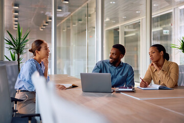 Multiracial business team having meeting in office.