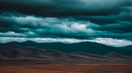 Moody skies over distant mountain range