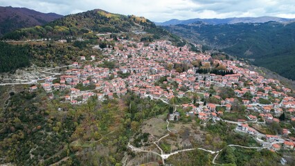 Aerial view around the mountain village Metsovo in Greece on an overcast afternoon in autumn