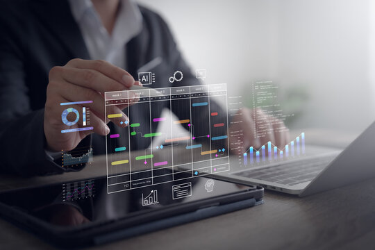 Project management and scheduling with AI technology. Plant managers use planning software to create Gantt charts to update progress and action plan tasks.