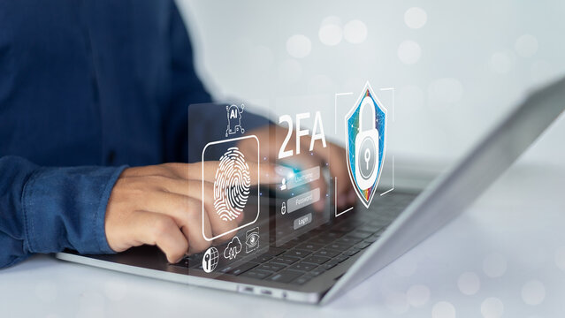 Close-up of hands typing on a laptop with 2FA biometric fingerprint authentication and an AI icon, - Powered by Adobe